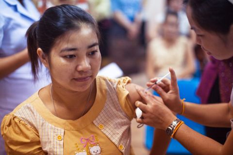 a girl receives a vaccination